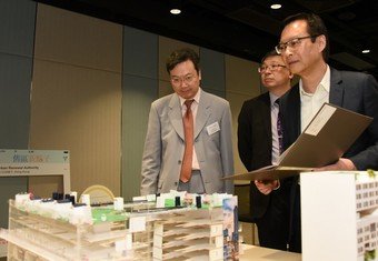 Non-Executive Director of the URA Board, Professor Eddie Hui (from left); Deputy Executive Director of the VTC, Ir Dr Eric Liu; and Managing Director of the URA, Ir Wai Chi-sing, assess the submissions to select the winning entries at the final adjudication cum award presentation ceremony.